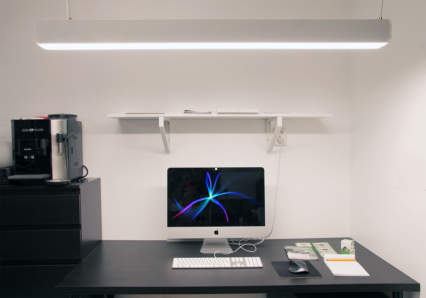 A custom-made luminaire to illuminate a work space. Inside the profile are colour temperature controlled LED strips so the light is efficient and can be adjusted as required. Ledstore.fi